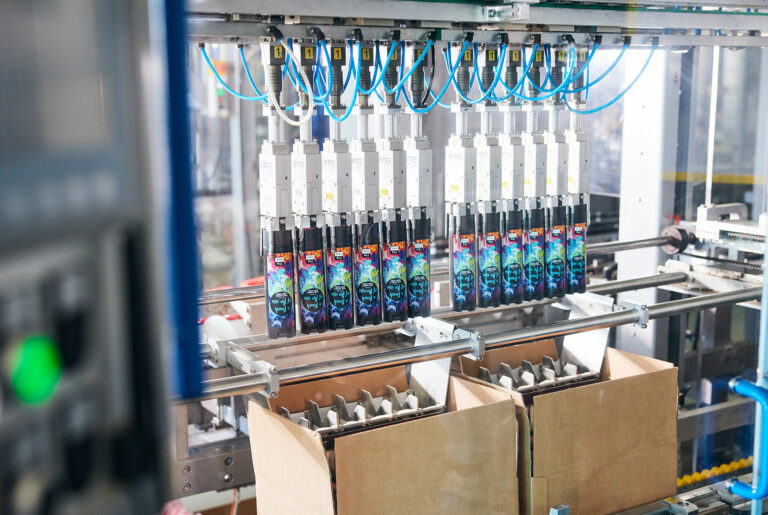 Bottle filling line at ADA Cosmetics production facility.