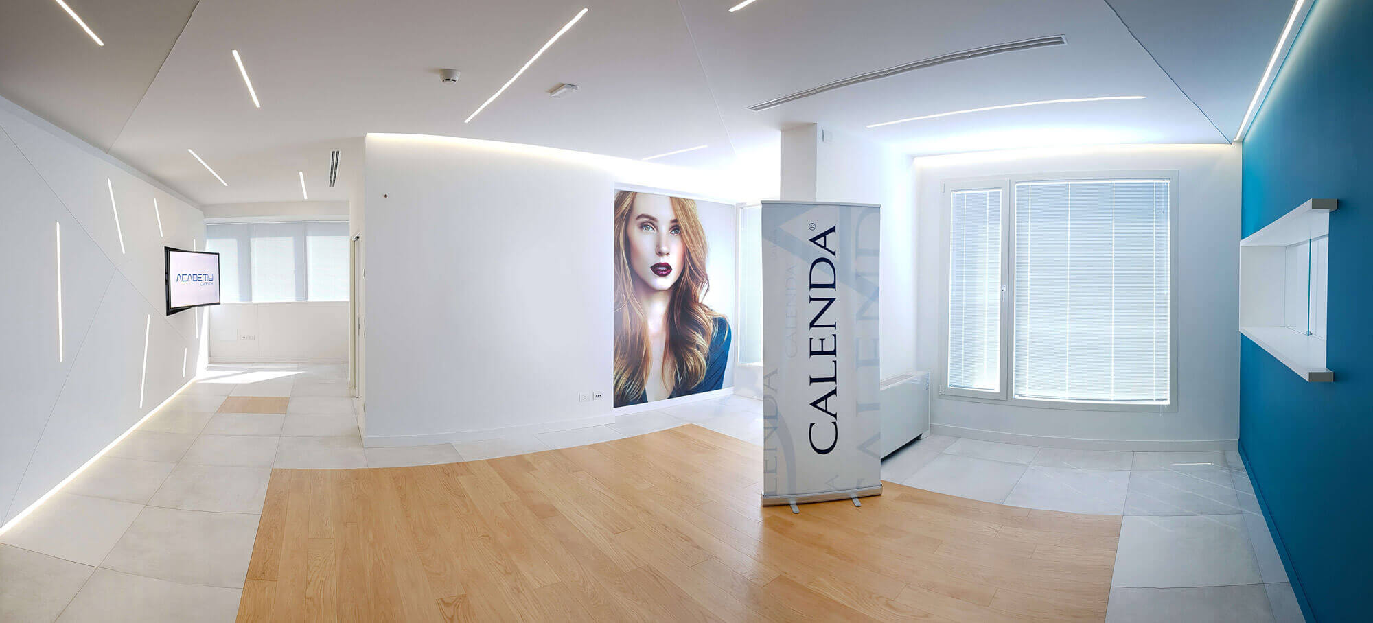 Calenda Academy reception hall with the Calenda wordmark on a freestanding column.