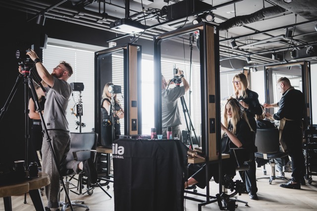 Behind-the-scenes of an Akademia Fale Loki Koki educational shoot: photographers capturing a styling demonstration with L'Oréal Professionel products.