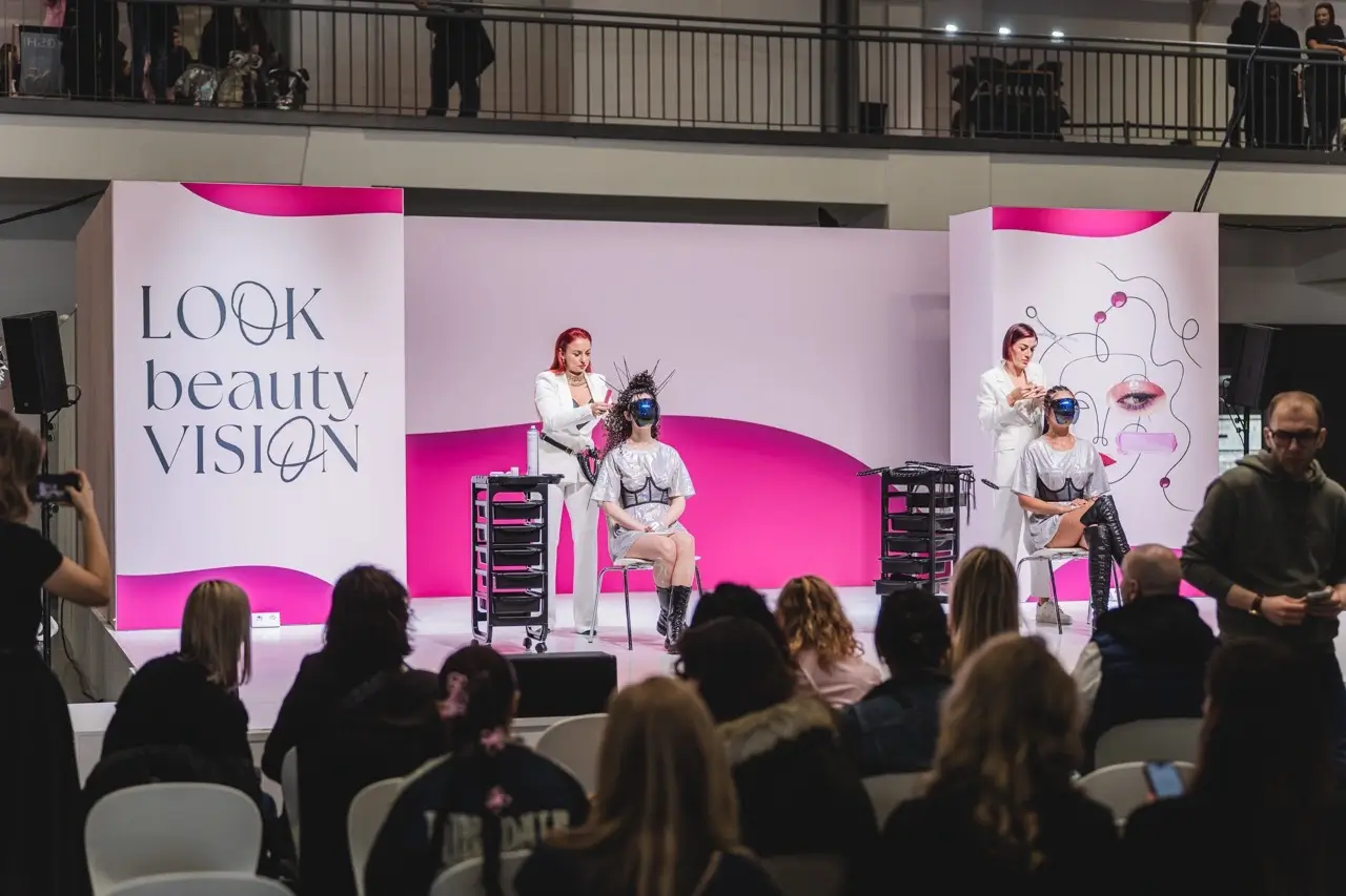 Fale Loki Koki 'LOOK beauty VISION' live show with stylists performing on stage in front of a seated audience.
