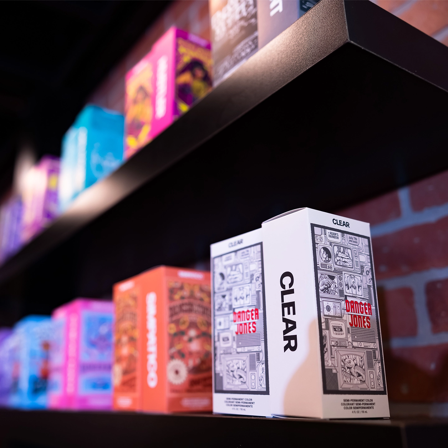 Danger Jones Clear semi-permanent colour box in front of a row of additional Gieseke-distributed colour brands on a dark shelf.