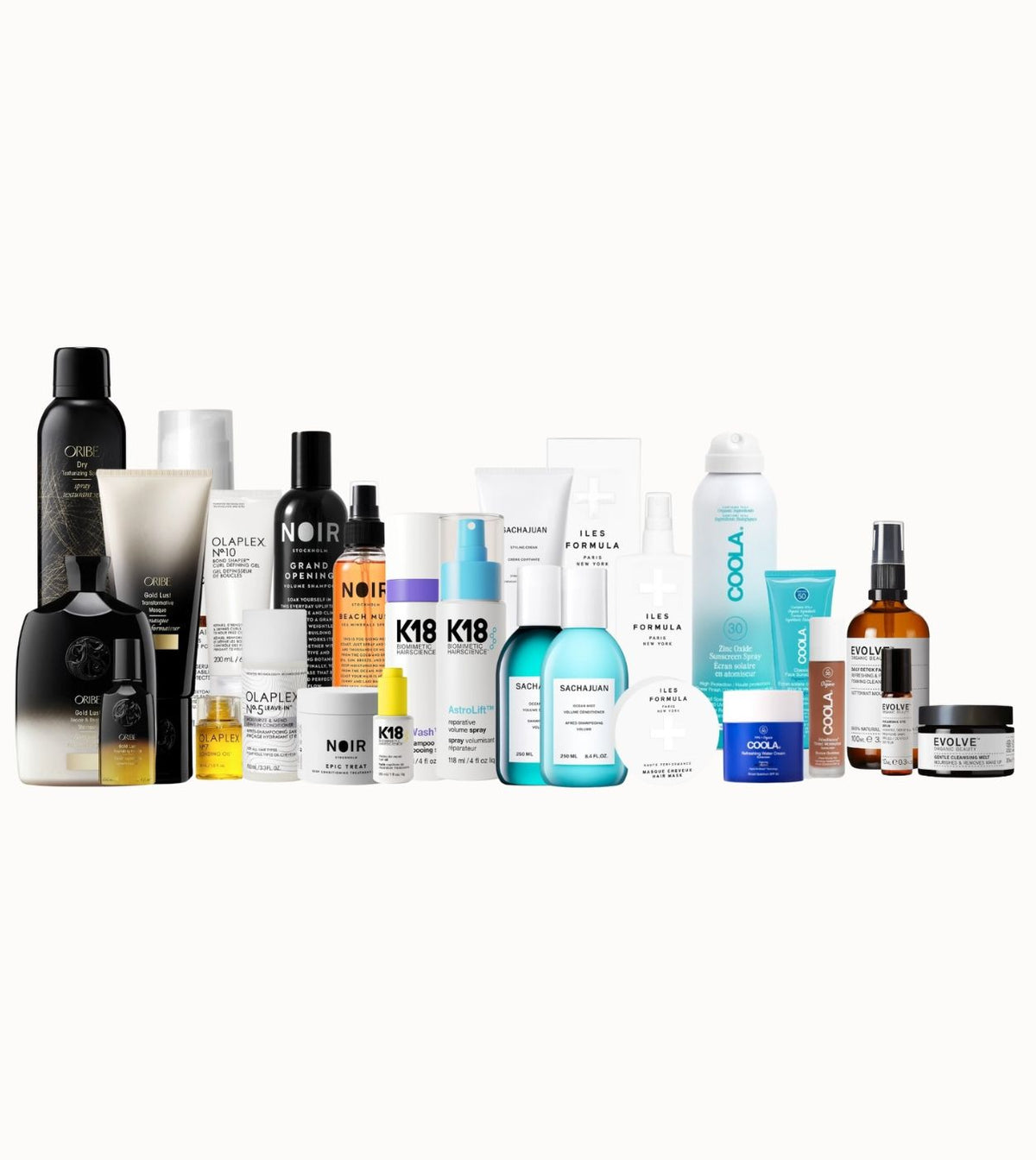 Wide product lineup of The White Space Company's prestige portfolio — Oribe, Olaplex, Noir Stockholm, K18, Sachajuan, Iles Formula, Coola, Verso and Evolve — arranged on a clean white backdrop.